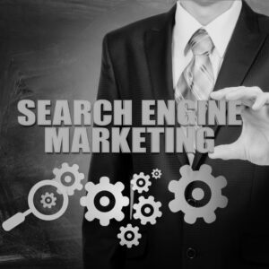 Businessman in suit holding gear icons with 'Search Engine Marketing' text overlay and magnifying glass symbol