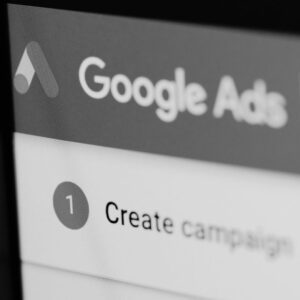 Close-up of computer screen showing Google Ads interface with 'Create Campaign' button visible